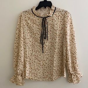 Gorgeous floral blouse with ruffle sleeves